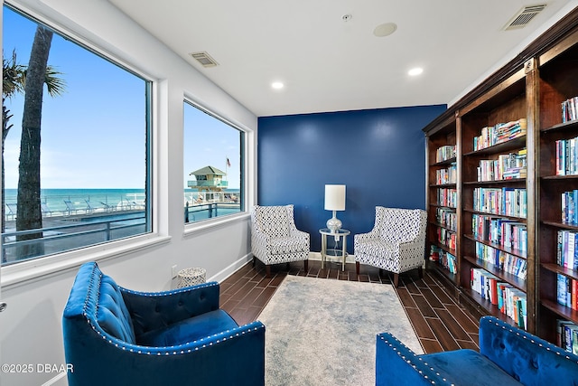 sitting room featuring a water view