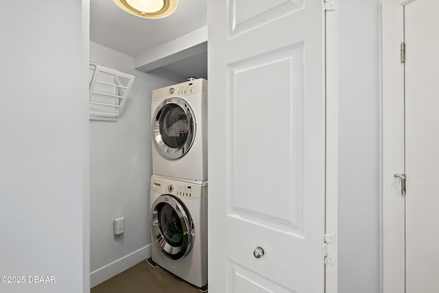 washroom with stacked washer / dryer