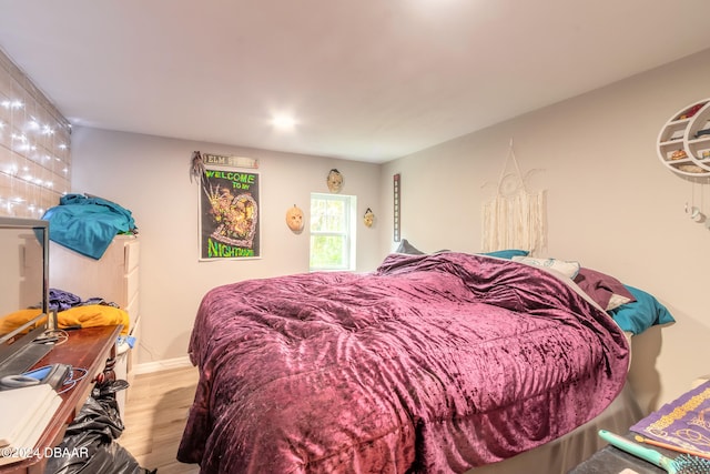 bedroom featuring wood-type flooring