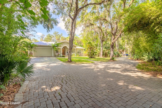 view of front of property with a garage