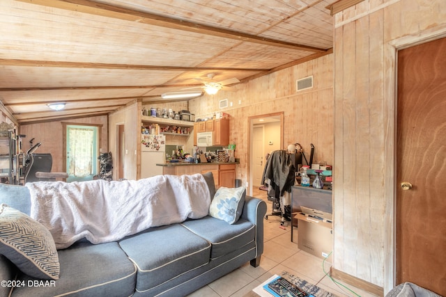 tiled living room with wood walls, vaulted ceiling with beams, and wooden ceiling