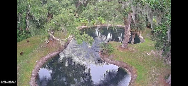 birds eye view of property featuring a water view