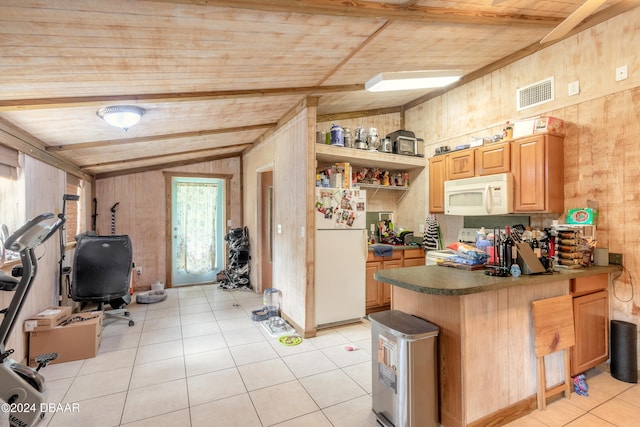 kitchen featuring lofted ceiling with beams, light tile patterned floors, wood walls, wood ceiling, and white appliances