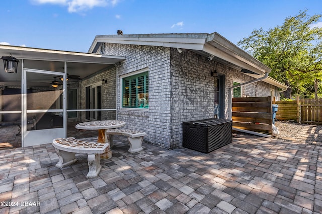 view of patio with a sunroom