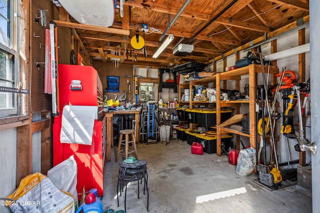 garage featuring a workshop area and a garage door opener