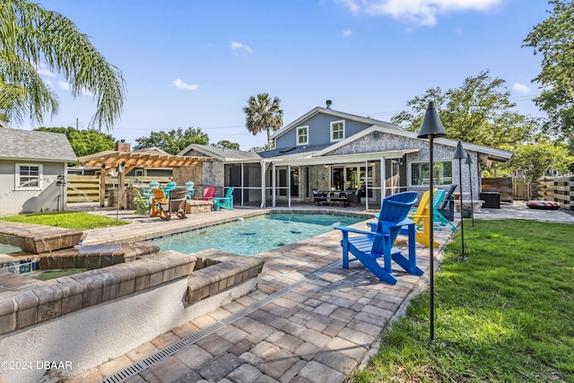 view of pool featuring a pergola, a patio, a lawn, and a sunroom