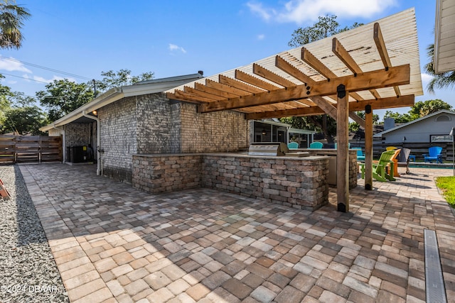 view of patio / terrace featuring a pergola, grilling area, an outdoor kitchen, and central AC