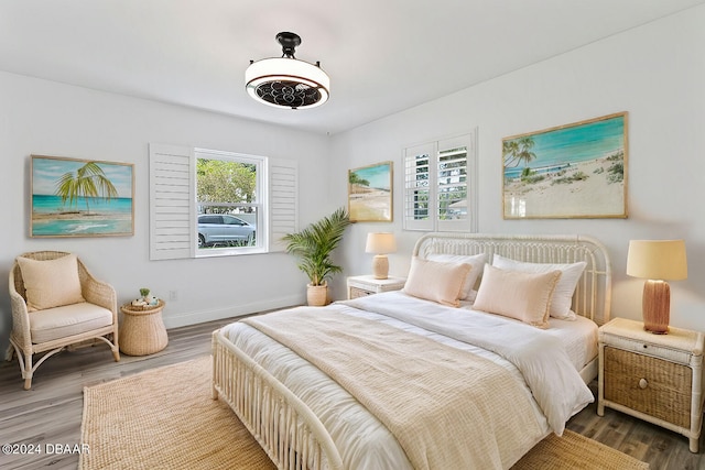 bedroom with hardwood / wood-style floors