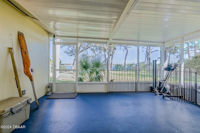 unfurnished sunroom featuring a wealth of natural light