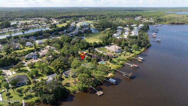 1949 Bayview Dr, New Smyrna Beach, FL 32168 - aerial overview of property's location featuring a nearby body of water, nearby suburban area, and a forest