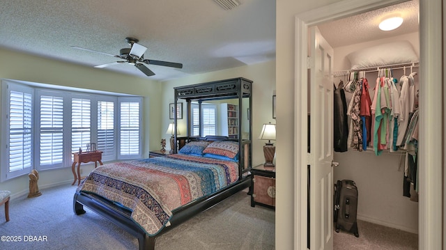 2942 Sea Oats Cir, Daytona Beach, FL 32118 - bedroom with a closet, a spacious closet, carpet flooring, a textured ceiling, and visible vents
