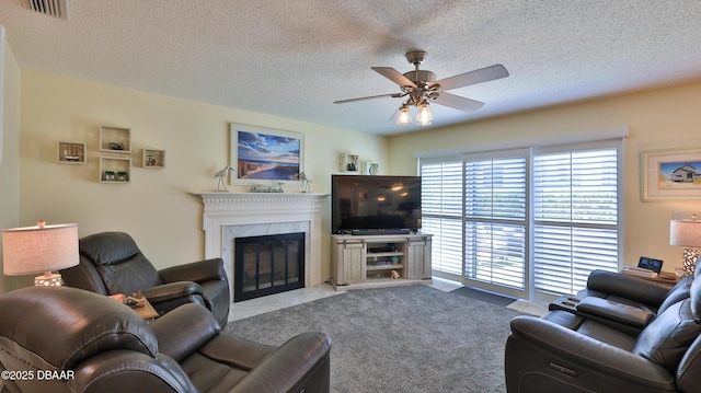 2942 Sea Oats Cir, Daytona Beach, FL 32118 - living room featuring a premium fireplace, a textured ceiling, a ceiling fan, and visible vents