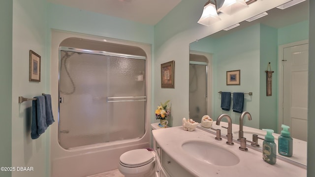 2942 Sea Oats Cir, Daytona Beach, FL 32118 - bathroom featuring enclosed tub / shower combo, vanity, and toilet