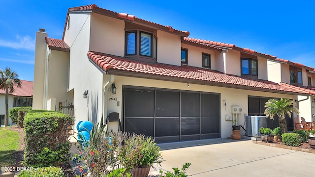2942 Sea Oats Cir, Daytona Beach, FL 32118 - view of front of property with stucco siding, a tile roof, and central AC