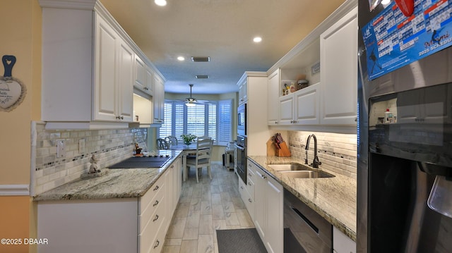 2942 Sea Oats Cir, Daytona Beach, FL 32118 - kitchen featuring white cabinetry, a sink, open shelves, and black appliances