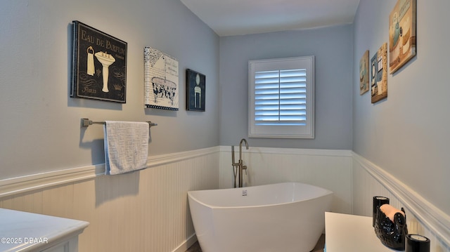 2942 Sea Oats Cir, Daytona Beach, FL 32118 - full bath with a soaking tub and wainscoting