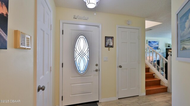 2942 Sea Oats Cir, Daytona Beach, FL 32118 - entryway with baseboards and stairs