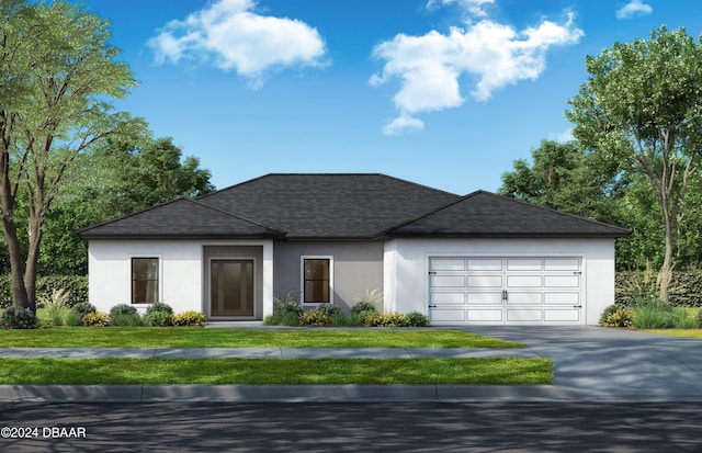 view of front of home with a garage and a front lawn