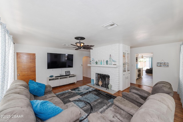 59 Arroyo Pkwy, Ormond Beach, FL 32174 - living room featuring a ceiling fan, wood finished floors, and a fireplace