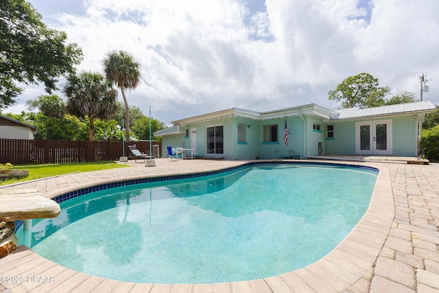 59 Arroyo Pkwy, Ormond Beach, FL 32174 - view of pool featuring french doors and a patio area