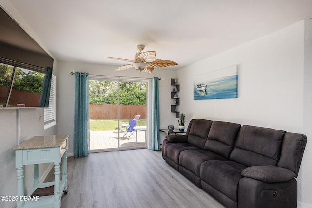 59 Arroyo Pkwy, Ormond Beach, FL 32174 - living area with plenty of natural light, ceiling fan, and light wood-style flooring