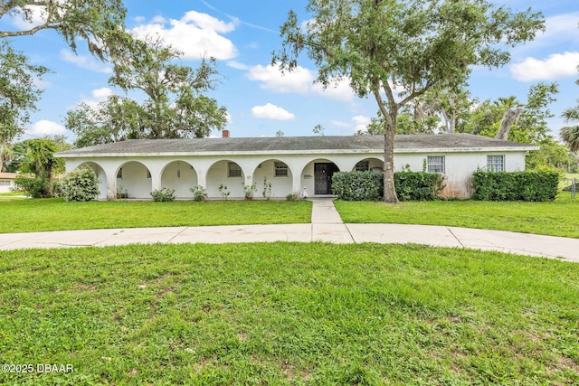 24 Tomoka Oaks Blvd, Ormond Beach, FL 32174 - ranch-style house featuring a front yard