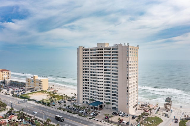 bird's eye view with a beach view and a water view