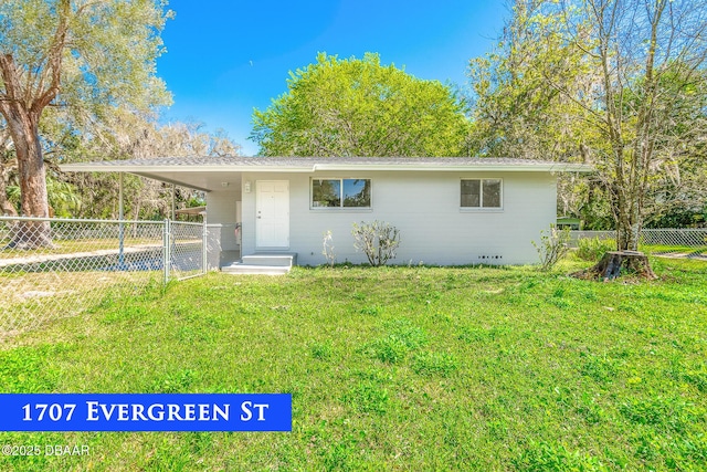 ranch-style home with crawl space, an attached carport, a front yard, and fence