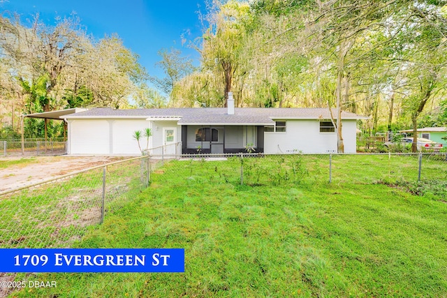 ranch-style house with driveway, a chimney, a front lawn, and fence