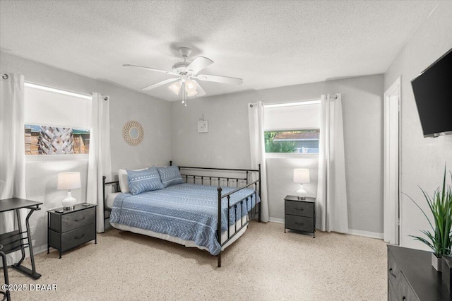 211 Fox Pl, Port Orange, FL 32127 - bedroom featuring a textured ceiling, speckle patterned floor, and ceiling fan