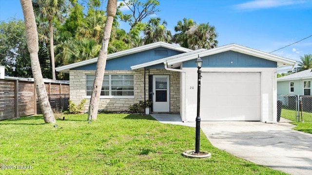 211 Fox Pl, Port Orange, FL 32127 - single story home featuring a garage, concrete driveway, and stone siding