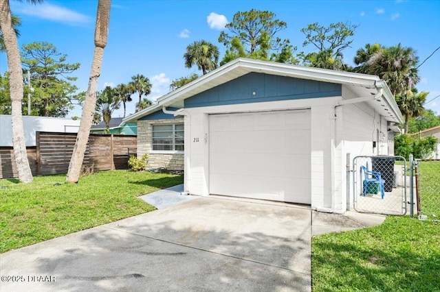 211 Fox Pl, Port Orange, FL 32127 - detached garage with driveway and a gate