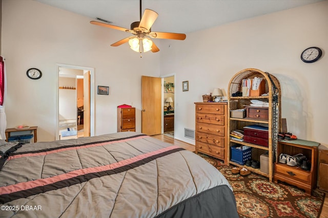 bedroom with visible vents, ceiling fan, and wood finished floors