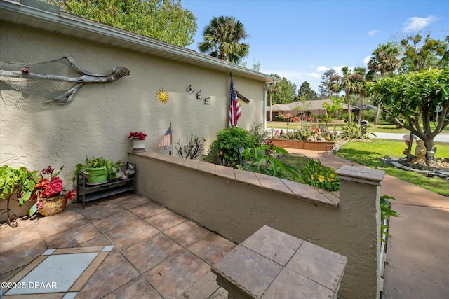 exterior space featuring a patio and stucco siding