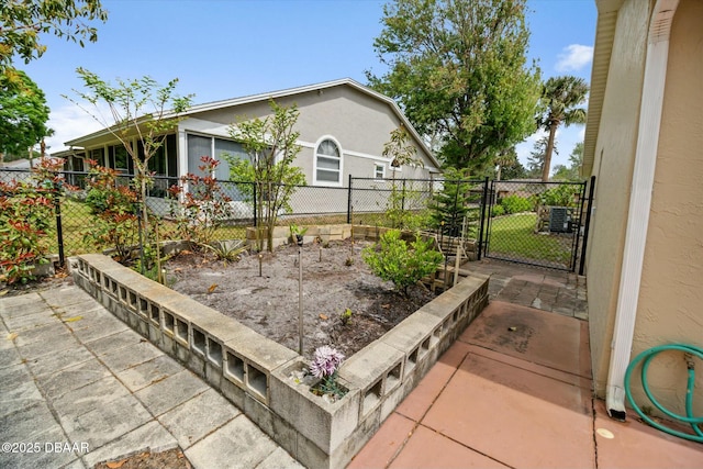 view of side of property featuring fence and a gate