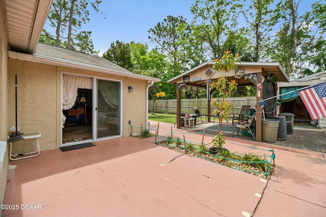 view of patio / terrace featuring fence