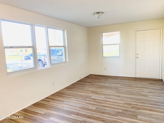 spare room featuring light hardwood / wood-style flooring