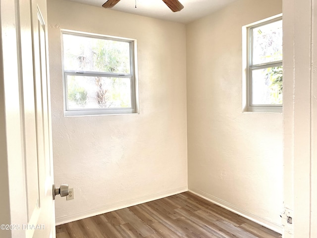 unfurnished room with hardwood / wood-style flooring