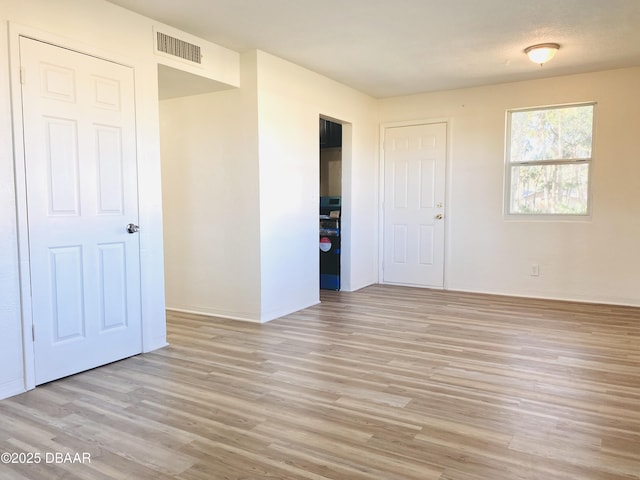 unfurnished bedroom featuring light wood-type flooring