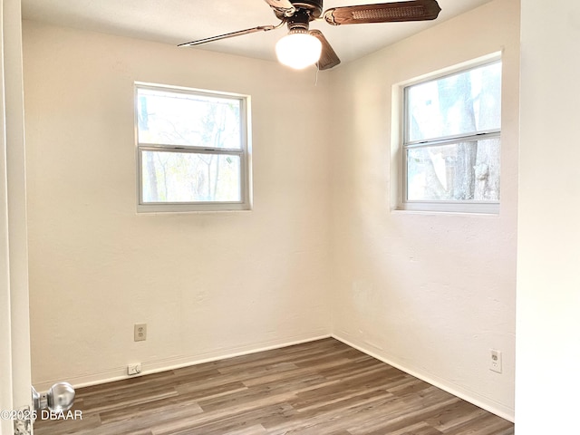 empty room featuring ceiling fan and wood-type flooring