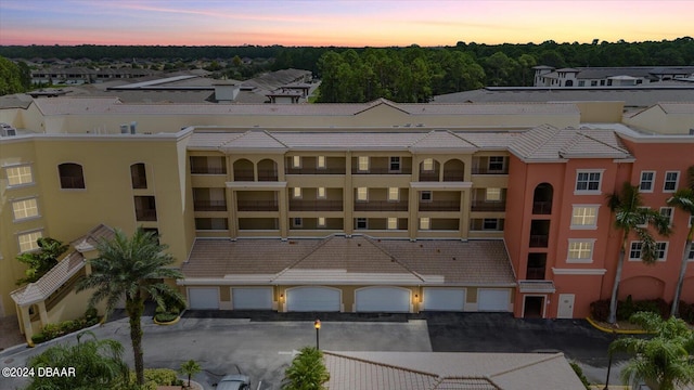 outdoor building at dusk with a garage