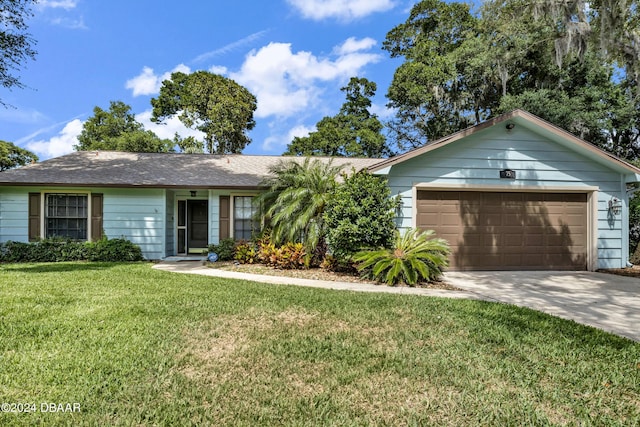 single story home featuring a garage and a front lawn