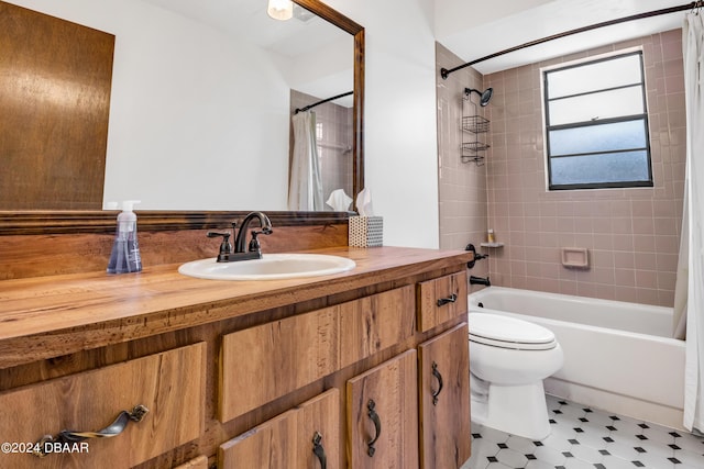 full bathroom with shower / bathtub combination with curtain, vanity, and toilet