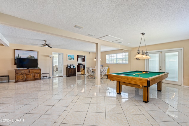 playroom featuring light tile patterned flooring, a textured ceiling, ceiling fan, and billiards