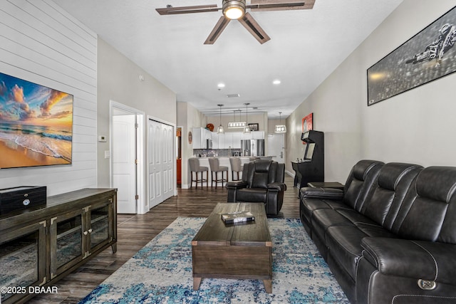 living area with dark wood finished floors, recessed lighting, and a ceiling fan