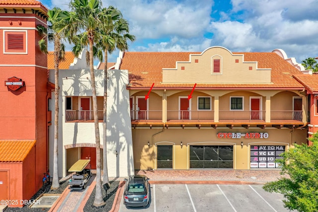 view of property featuring uncovered parking