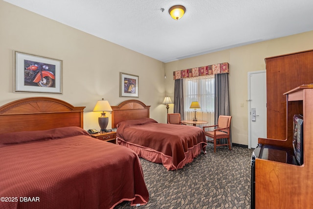 bedroom featuring dark carpet