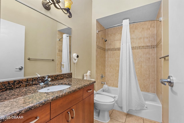 full bath featuring tile patterned floors, shower / bath combination with curtain, toilet, and vanity