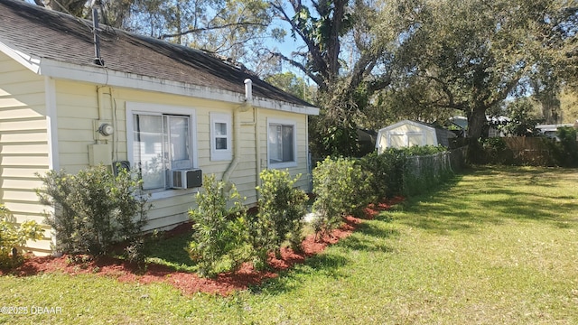 view of yard featuring cooling unit and fence