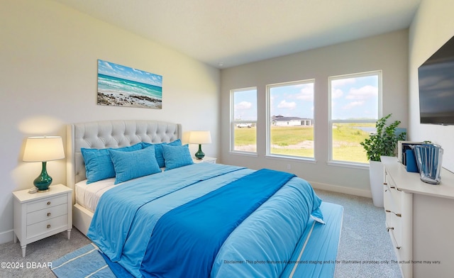 carpeted bedroom with baseboards